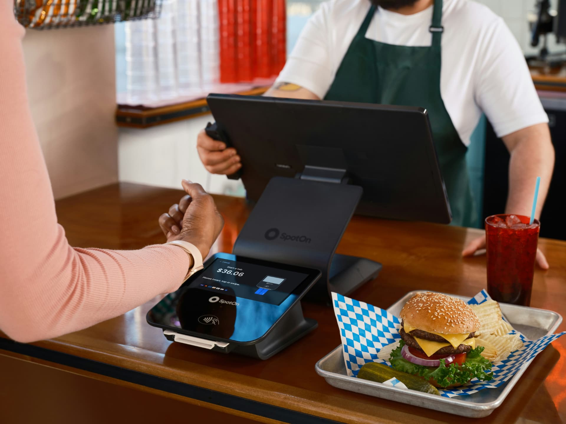 Guest paying at a quick service checkout